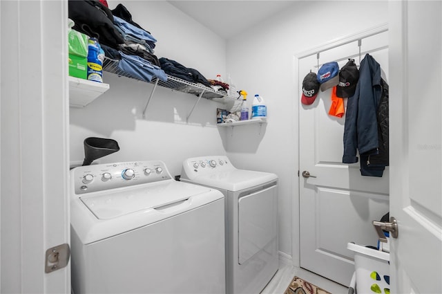 clothes washing area featuring independent washer and dryer