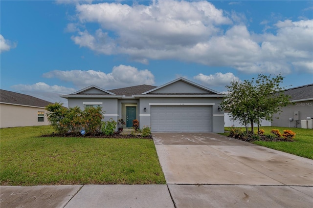 ranch-style house with a garage and a front lawn