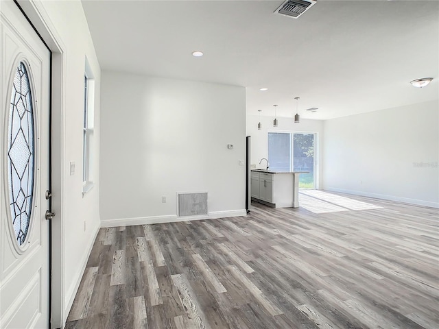 spare room with light wood-type flooring