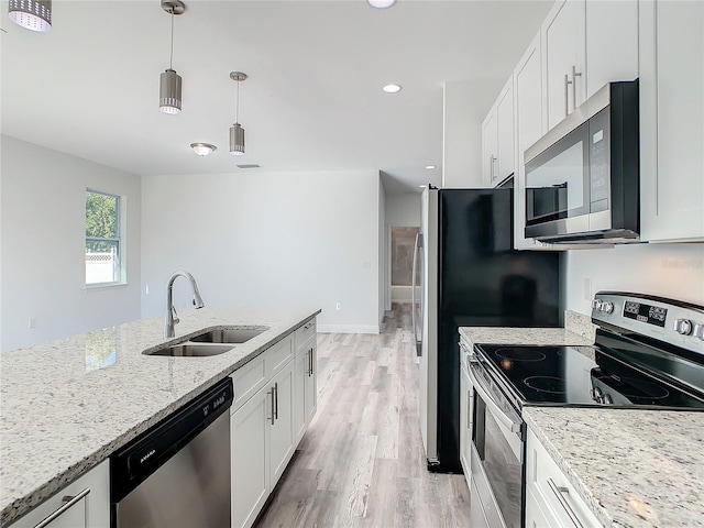 kitchen featuring white cabinets, sink, and appliances with stainless steel finishes