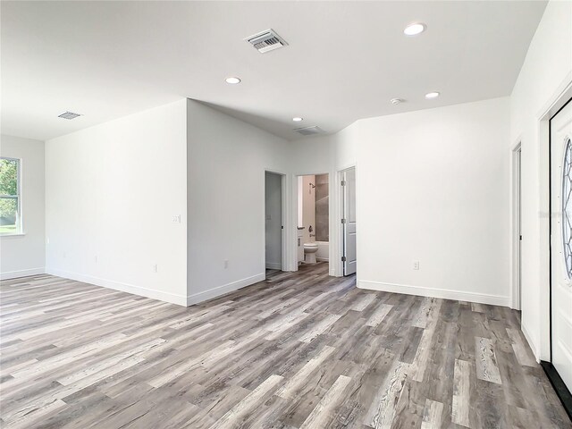 spare room featuring light hardwood / wood-style floors