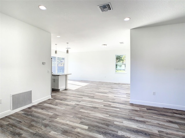 empty room with dark hardwood / wood-style floors