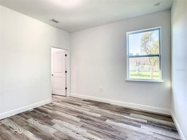 empty room featuring hardwood / wood-style floors