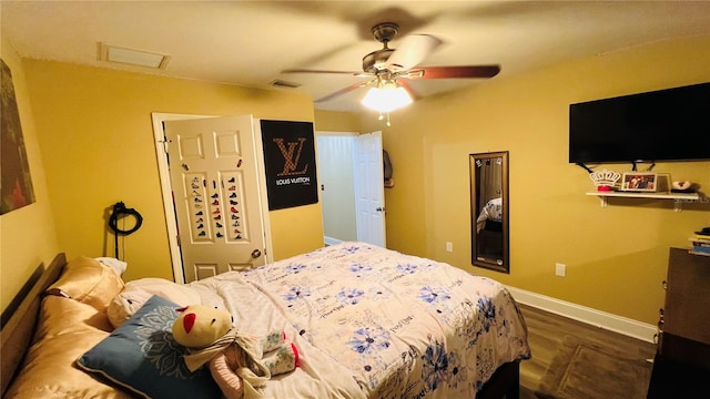 bedroom featuring ceiling fan and dark hardwood / wood-style flooring