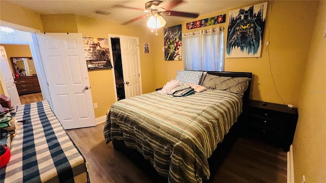 bedroom with hardwood / wood-style floors and ceiling fan