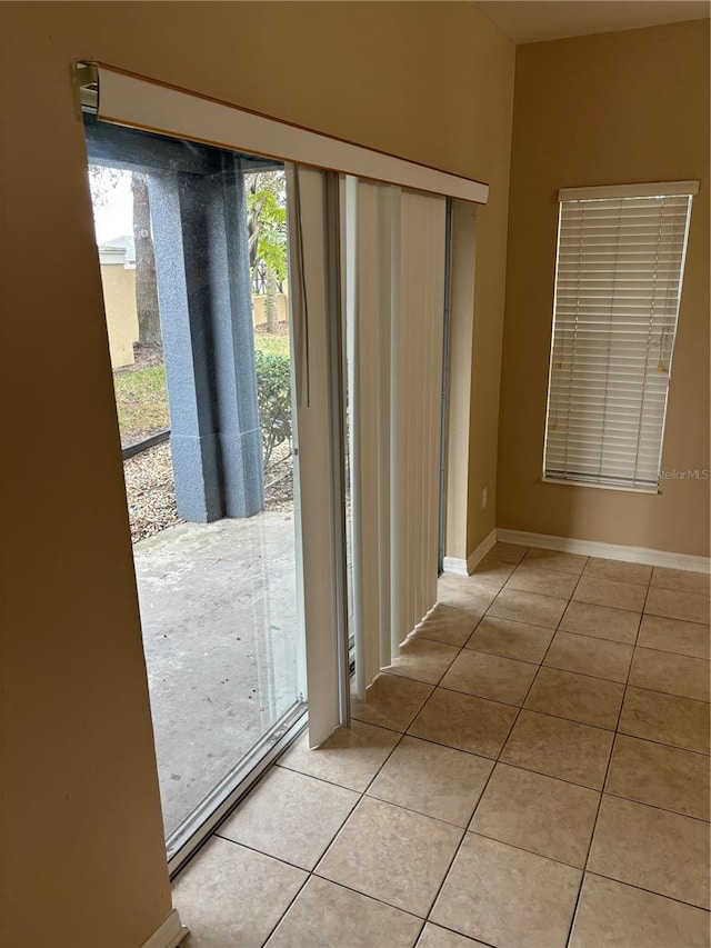 entryway with light tile patterned floors