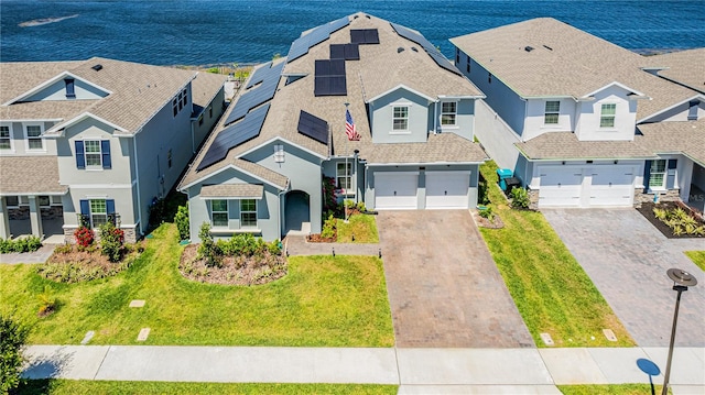 view of front of property with a water view and a front yard