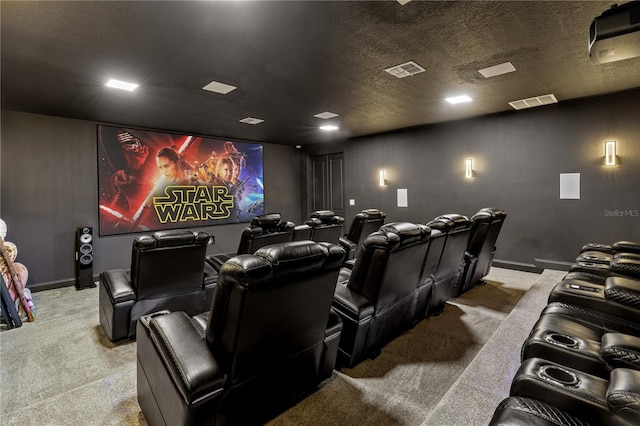 carpeted home theater featuring a textured ceiling