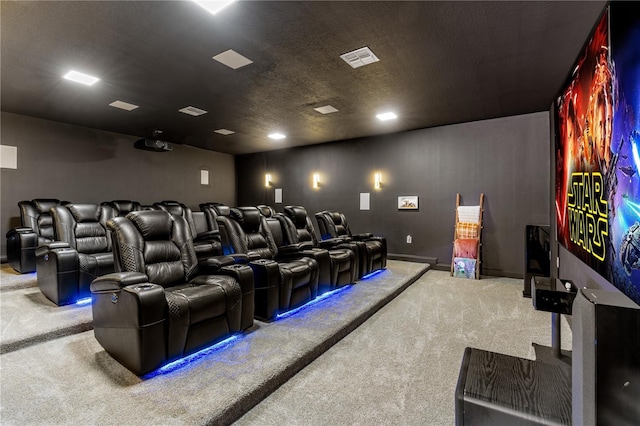 carpeted home theater featuring a textured ceiling