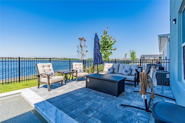 view of patio / terrace featuring an outdoor living space, central AC, and a water view