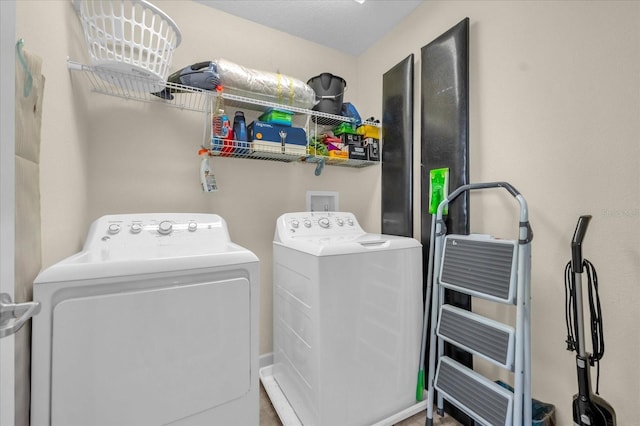 washroom with separate washer and dryer