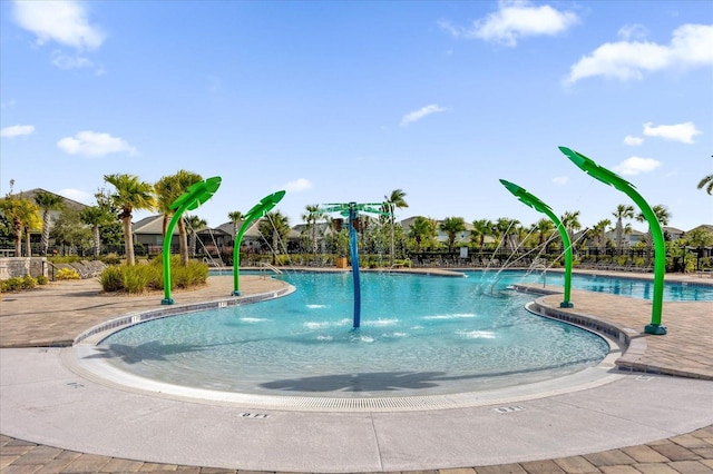 view of pool featuring a patio area and pool water feature