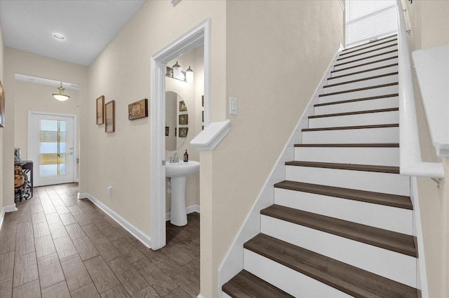 stairs with wood-type flooring