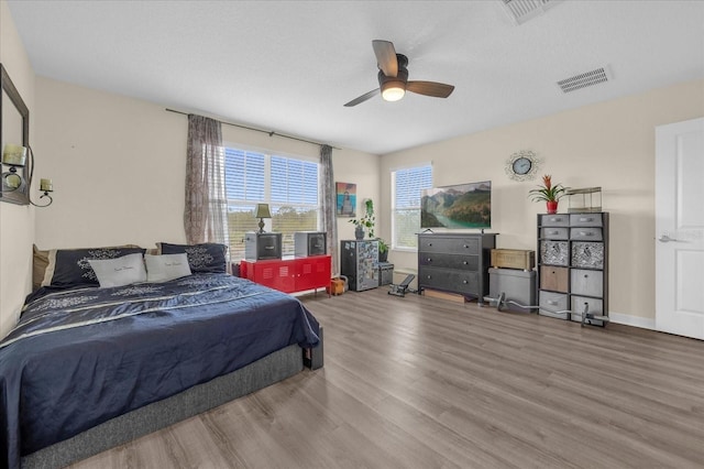 bedroom featuring wood-type flooring and ceiling fan