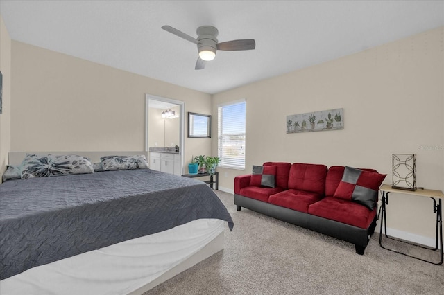 carpeted bedroom featuring connected bathroom and ceiling fan