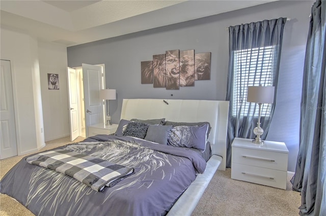 bedroom featuring light carpet