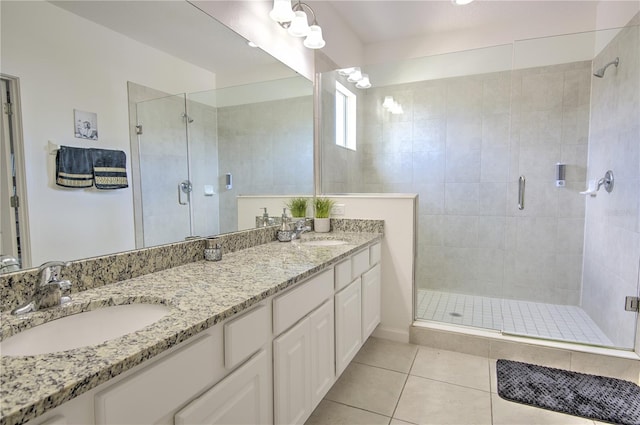 bathroom with vanity, tile patterned floors, and a shower with shower door