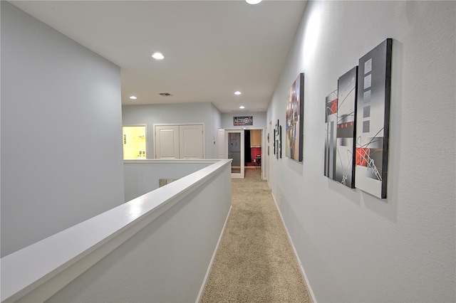 hallway with light carpet