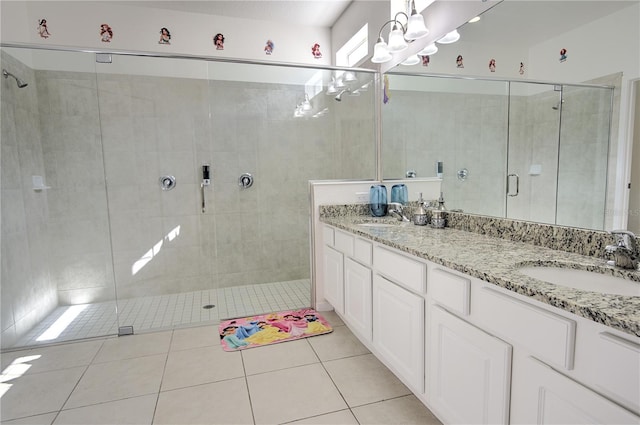 bathroom featuring an enclosed shower, vanity, and tile patterned floors