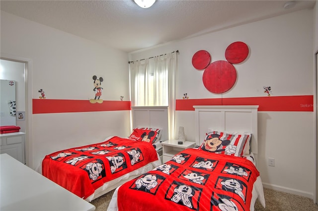 carpeted bedroom with a textured ceiling