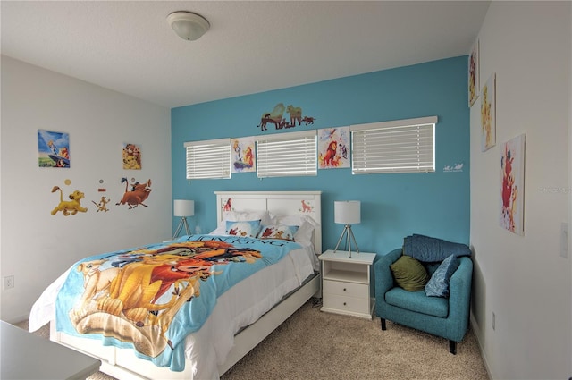 bedroom featuring light colored carpet