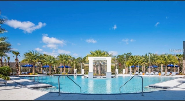 view of swimming pool featuring a patio area