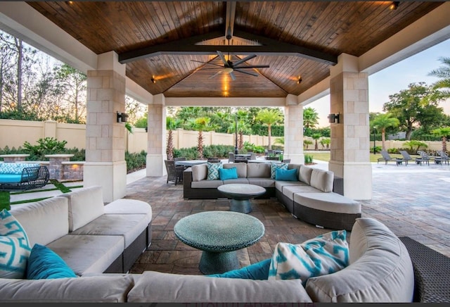 view of patio with ceiling fan, an outdoor hangout area, and a gazebo