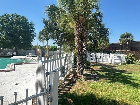 view of pool with a yard and a patio area