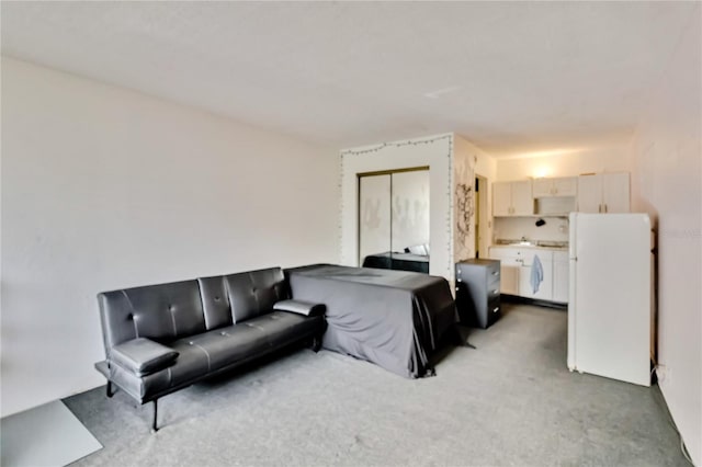 bedroom with white fridge