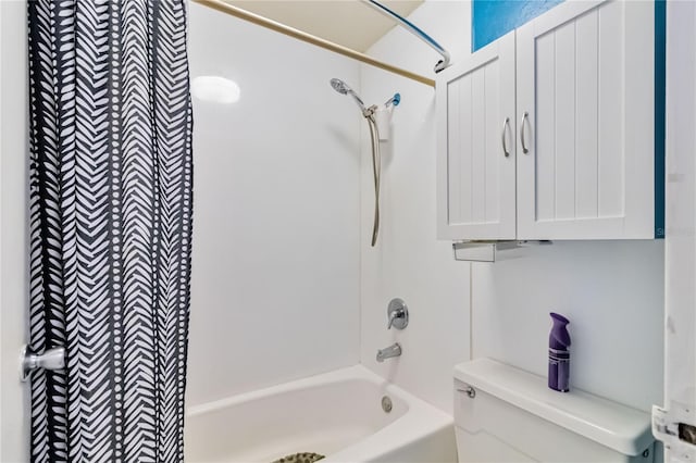 bathroom with toilet and washtub / shower combination