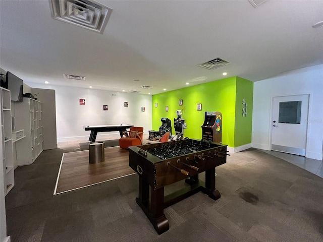 game room featuring dark colored carpet