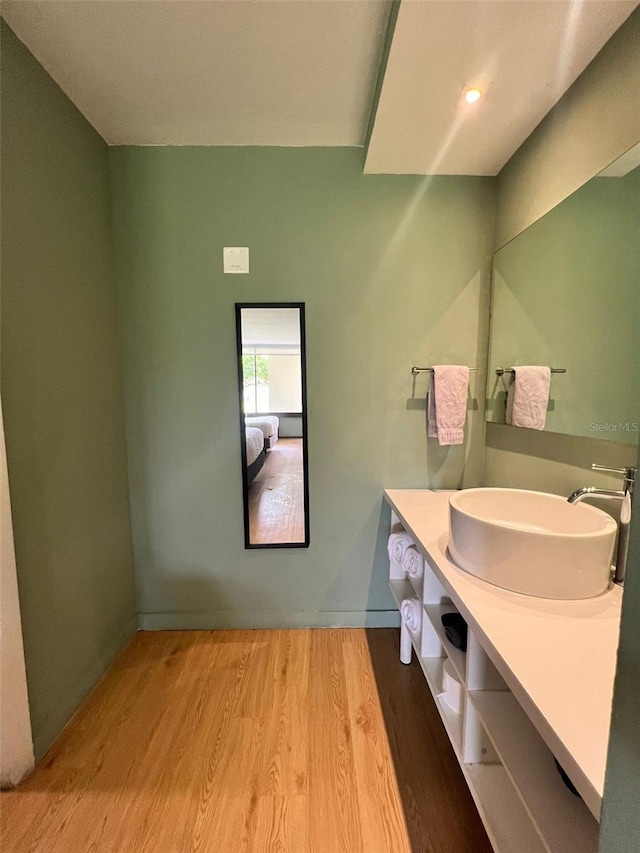 bathroom featuring wood-type flooring and vanity