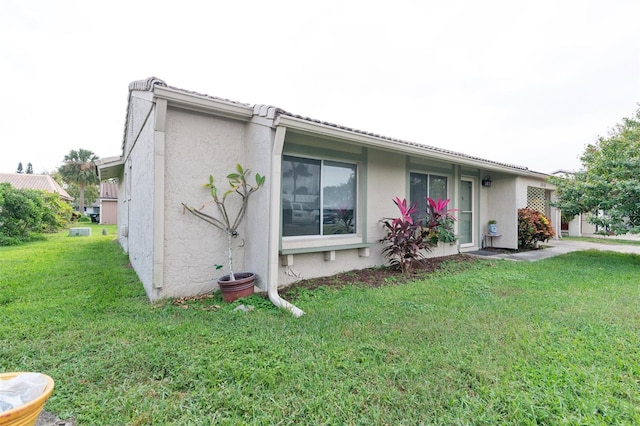 view of home's exterior featuring a lawn