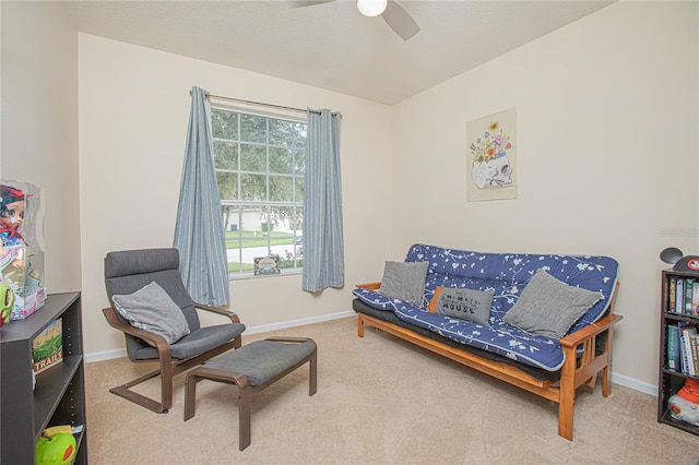 sitting room with carpet flooring and ceiling fan