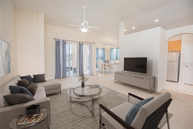 tiled living room featuring ceiling fan