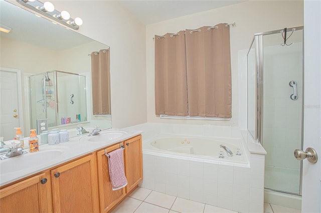 bathroom with vanity, independent shower and bath, and tile patterned floors