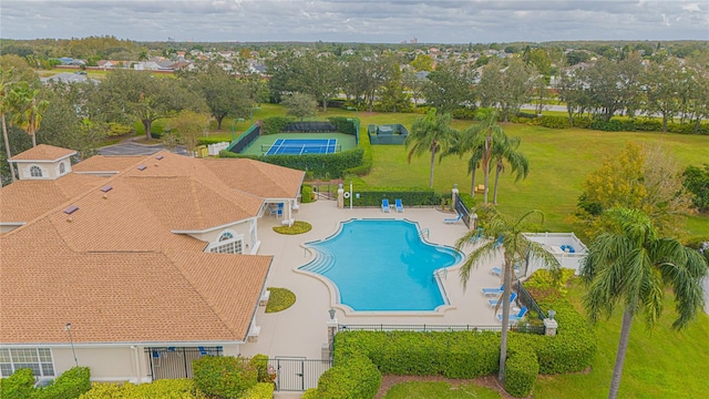 view of pool with a lawn and a patio area