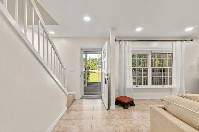 foyer featuring light tile patterned flooring