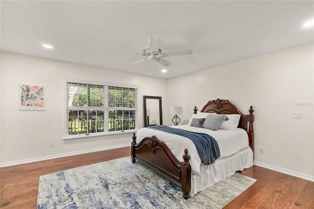 bedroom with hardwood / wood-style flooring and ceiling fan