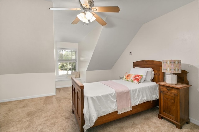 bedroom featuring ceiling fan, light carpet, and lofted ceiling