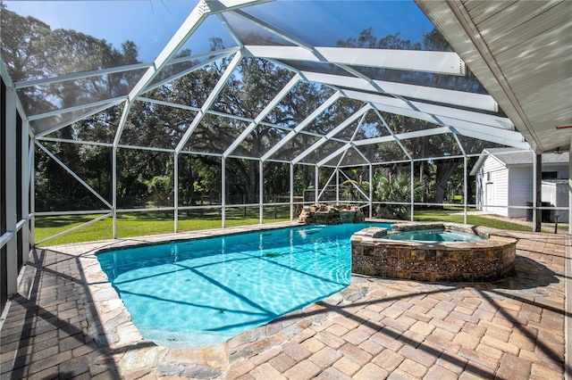 view of pool with a patio area, a lawn, a lanai, and an in ground hot tub