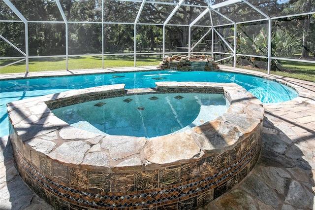 view of pool with glass enclosure, pool water feature, and an in ground hot tub