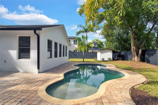 view of swimming pool featuring a patio area