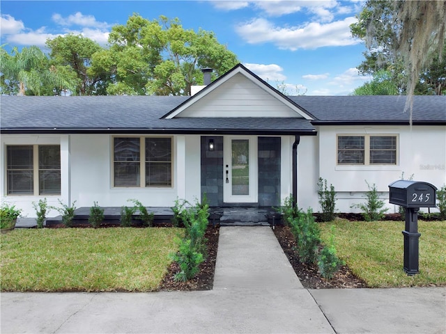 ranch-style house featuring a front lawn