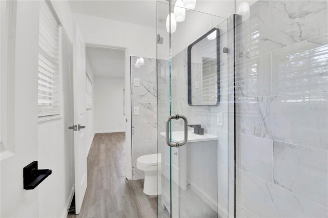 245 W George Ave, Maitland, FL 32751 - bathroom featuring tile walls, a shower stall, and wood finished floors