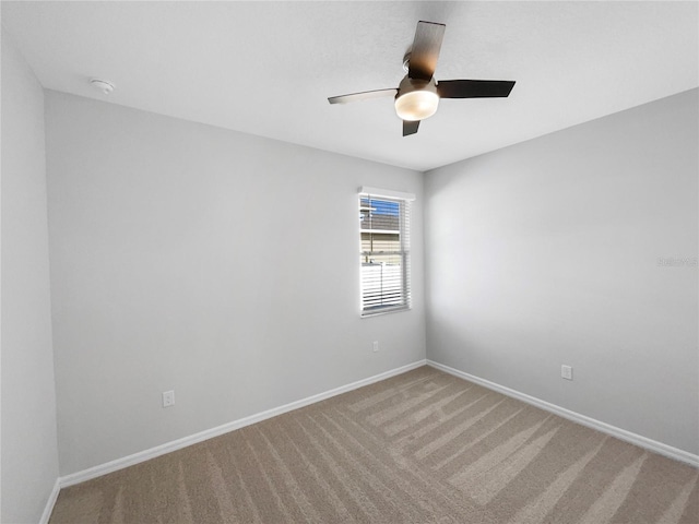 spare room with carpet flooring and ceiling fan