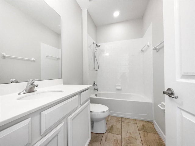 full bathroom with toilet, tiled shower / bath combo, and vanity