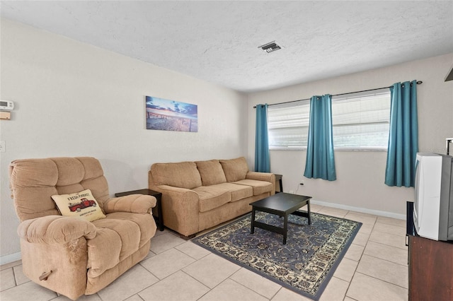 tiled living room with a textured ceiling