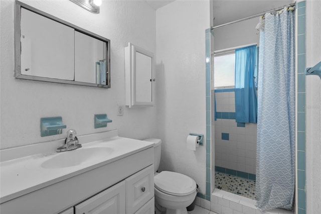 bathroom featuring walk in shower, vanity, and toilet