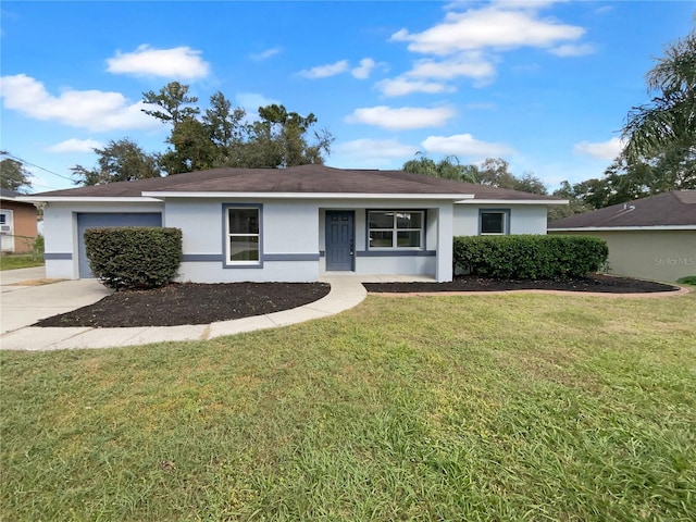 ranch-style home with a garage and a front yard